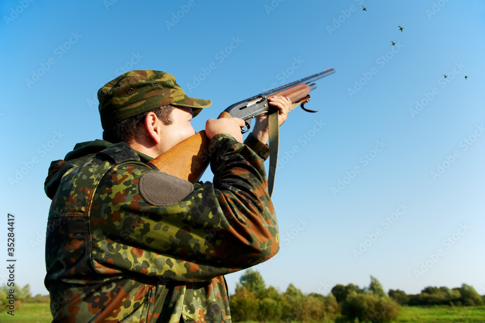hunter shooting with rifle gun hunter shooting with rifle gun