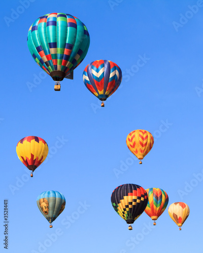 hot air balloons over blue sky