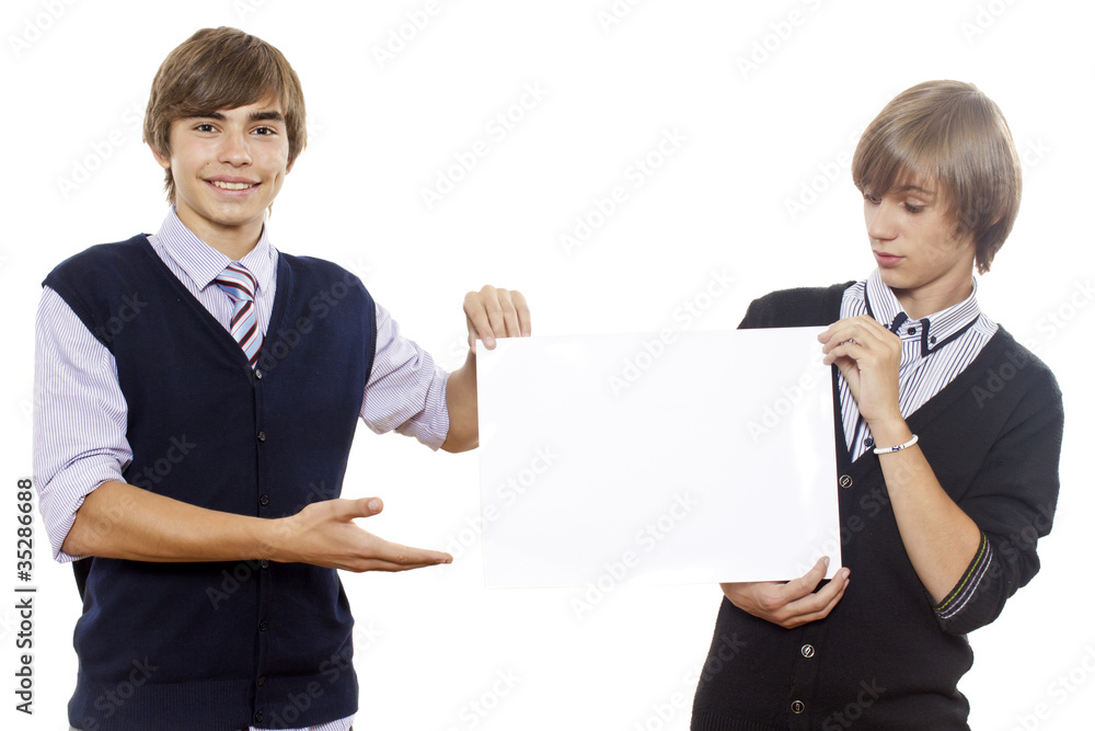 Two young guys hold blank sheet / white poster Two young guys hold blank sheet / white poster