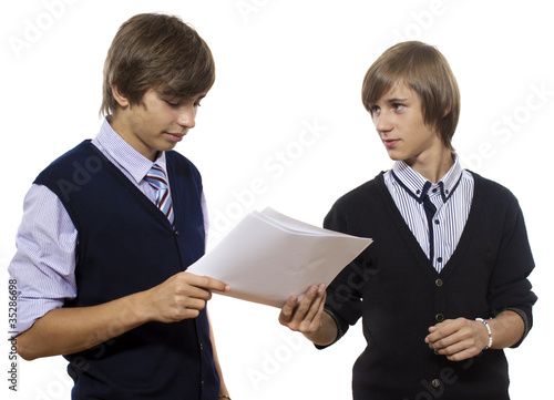 Two boys holds a white paper on white background