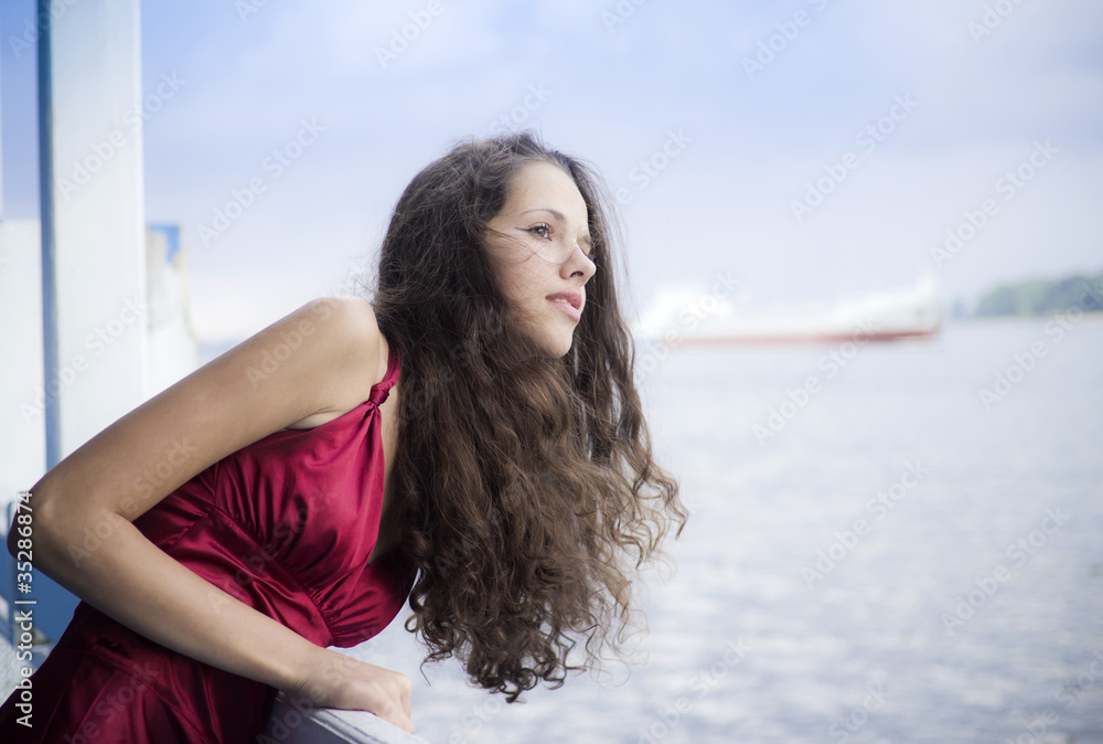 Portrait of beautiful brunette looking into the distance Portrait of beautiful brunette looking into the distance