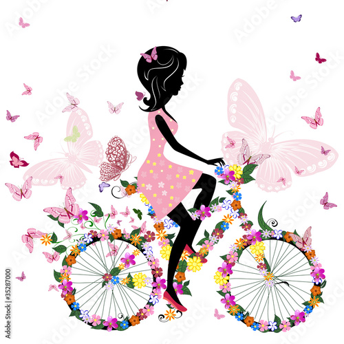 Dziewczyna na rowerze z romantycznymi motylami
