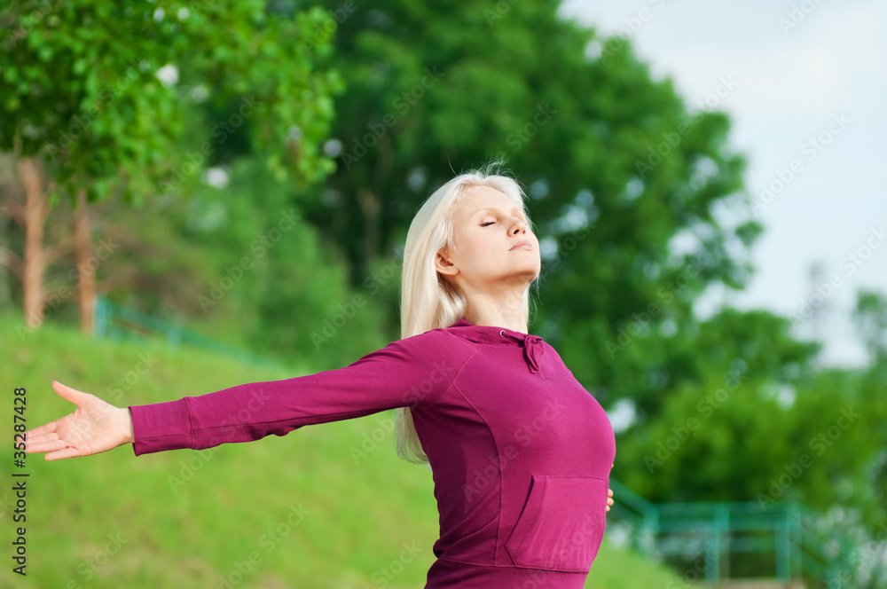 Beautiful woman doing yoga stretching exercise Beautiful woman doing yoga stretching exercise