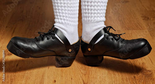 feet in step shoes and white socks
