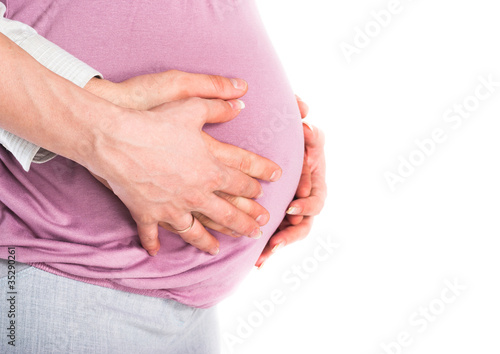Wallpaper Mural Man's and female hands hold a stomach of the pregnant woman Torontodigital.ca