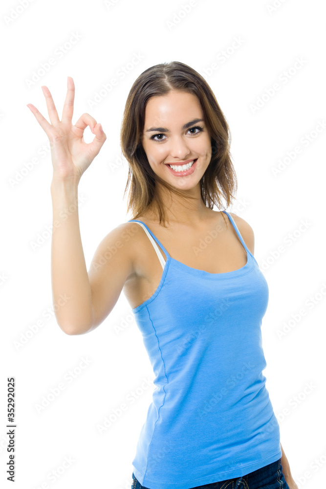 Young woman in sports wear showing OK gesture Young woman in sports wear showing OK gesture