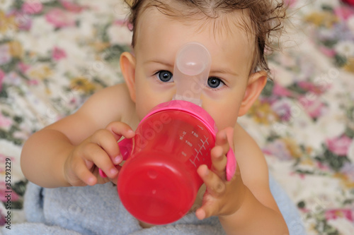 Baby girl with sippy