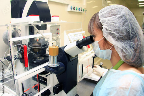 Young female doctor working with a microscope in a laboratory