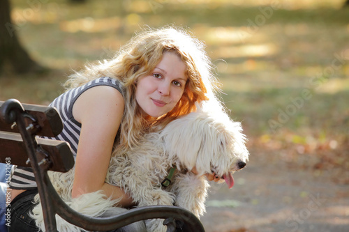 Wallpaper Mural Beautiful girl with dog in late afternoon in park Torontodigital.ca