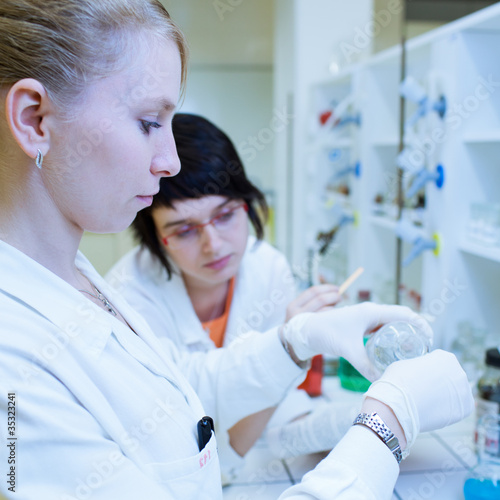 female researchers carrying out research together in a lab