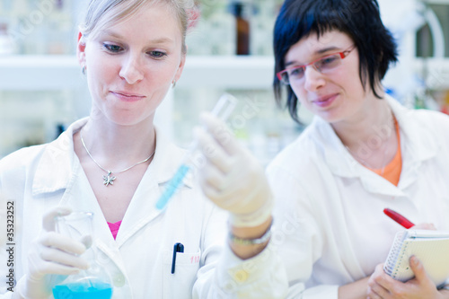 female researchers carrying out research together in a lab
