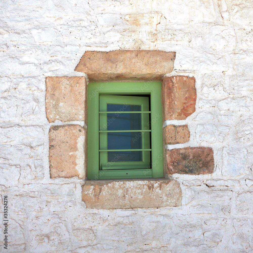 green window in a Greek island