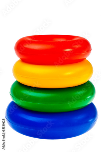 Wallpaper Mural Colorful round plastic toys stacked over white background. Torontodigital.ca