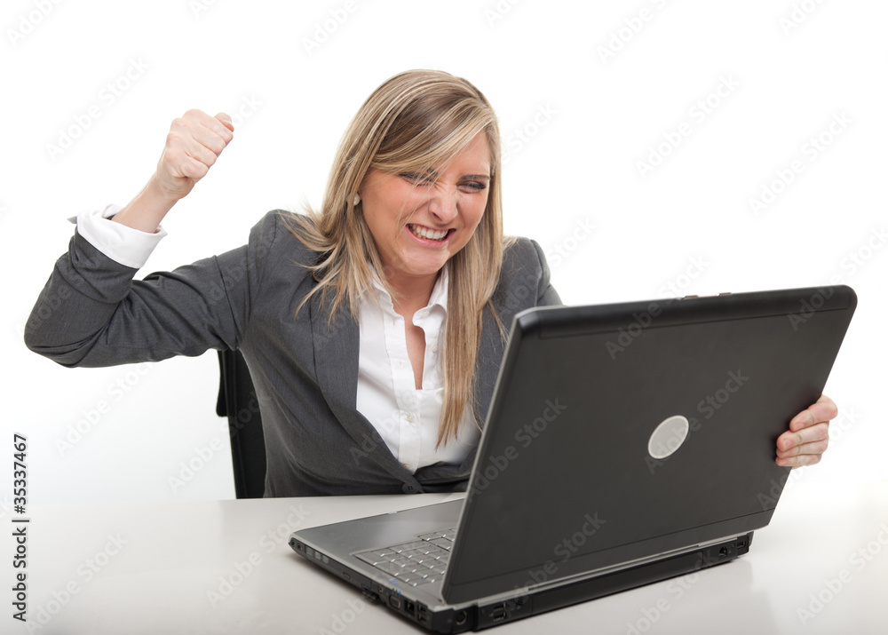 Businesswoman attacking her computer Businesswoman attacking her computer