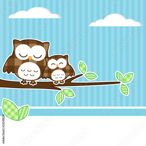 Card with two owls on branch with textile background.