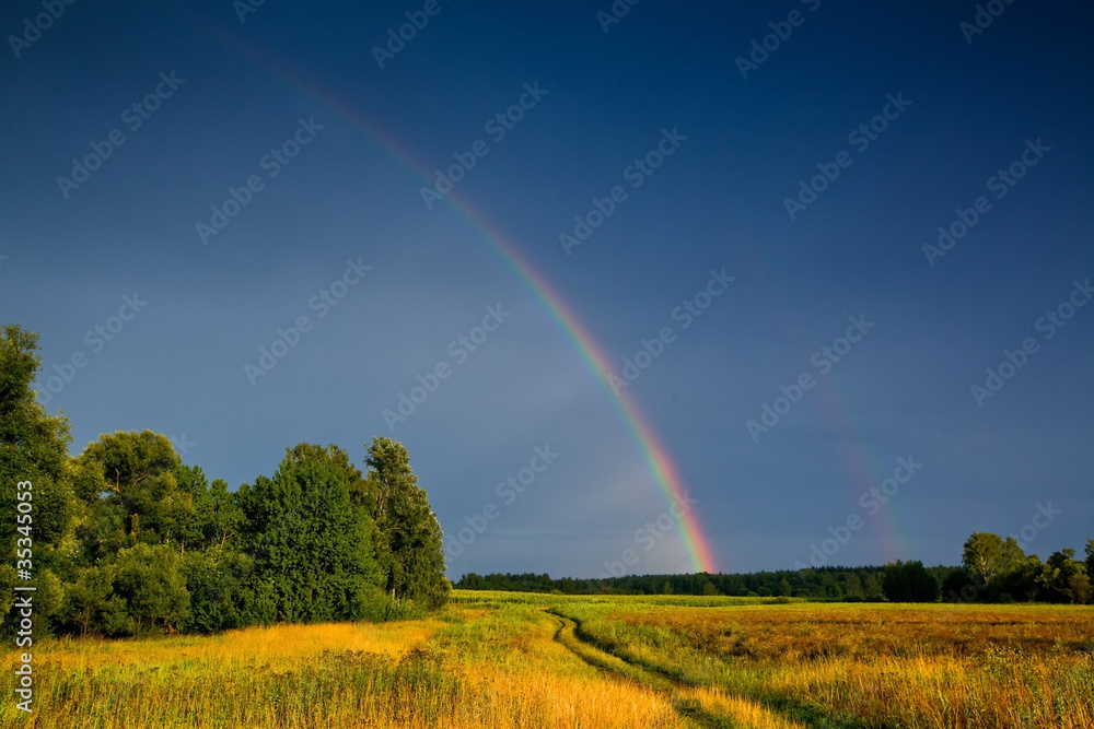 Landscape with country road and rainbow Landscape with country road and rainbow