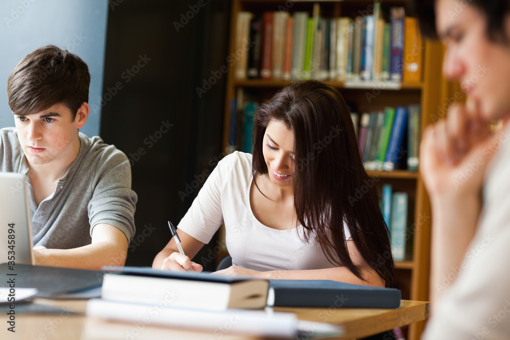 Students working on an essay Students working on an essay