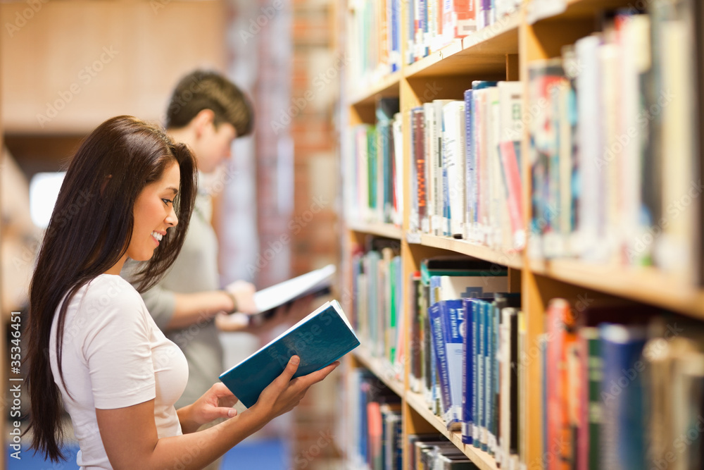 Students reading while standing up Students reading while standing up