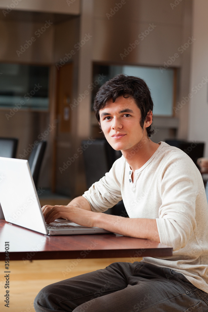 Portrait of a handsome man using a laptop Portrait of a handsome man using a laptop