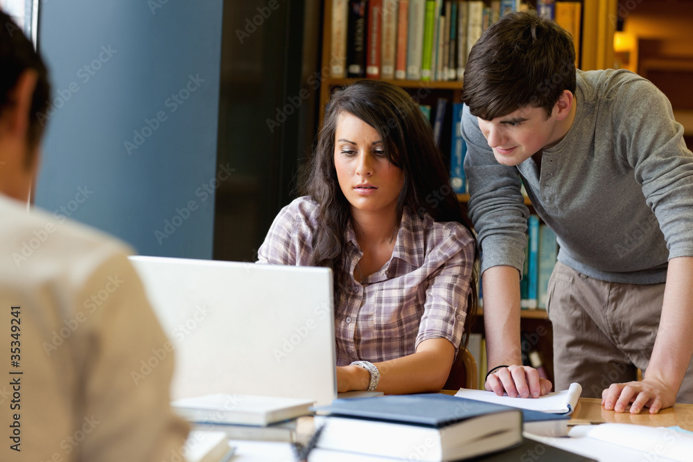 Students working together with a laptop Students working together with a laptop
