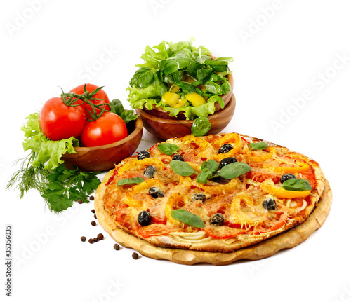 Pizza and fresh vegetables isolated on white