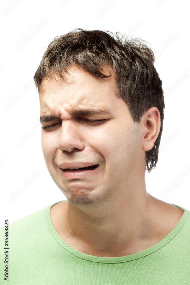 portrait of crying young man isolated on white background portrait of crying young man isolated on white background