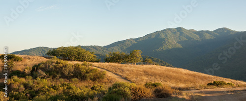 Panorama of a typical Central California sunset over meadow