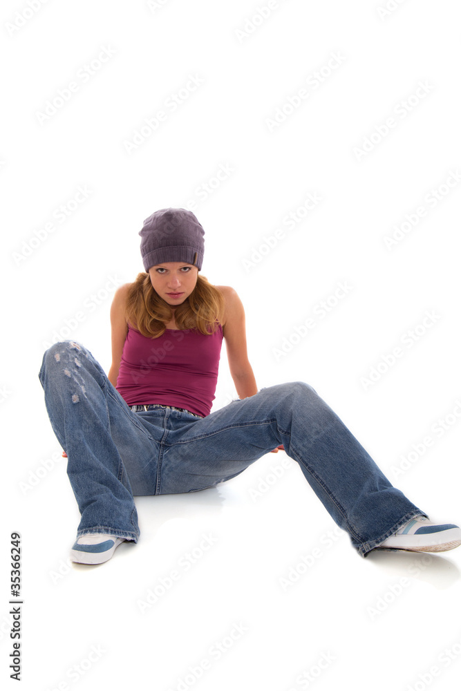 pretty girl- teenager in jeans sitting on a white background pretty girl- teenager in jeans sitting on a white background