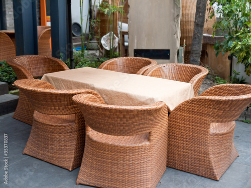 House patio with wicker sofas and tabel. photo