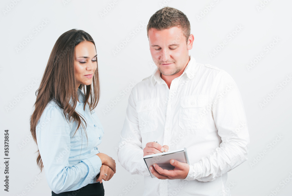 Two young happy smiling businesspeople, or businessman and clien Two young happy smiling businesspeople, or businessman and clien