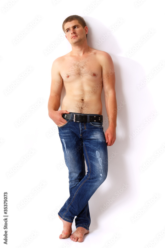 man young handsome athlete with with blue jeans barefoot Stock Photo |  Adobe Stock