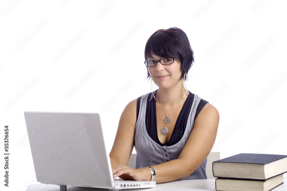 young female student at her desk young female student at her desk