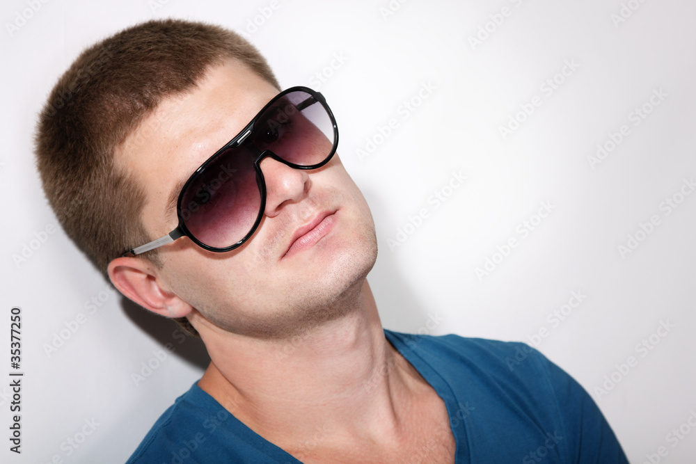 man young handsome athlete with sunglasses and t-shirt man young handsome athlete with sunglasses and t-shirt