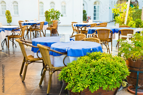 Tables and chairs in outdoor restaurant