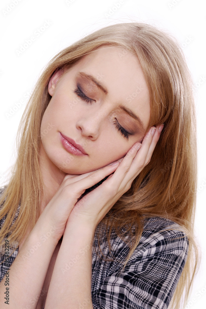 Beauty shoot of a woman showing sleeping gesture Beauty shoot of a woman showing sleeping gesture