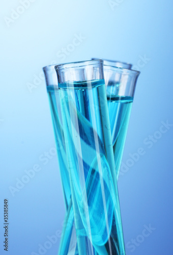 Test-tubes on blue background