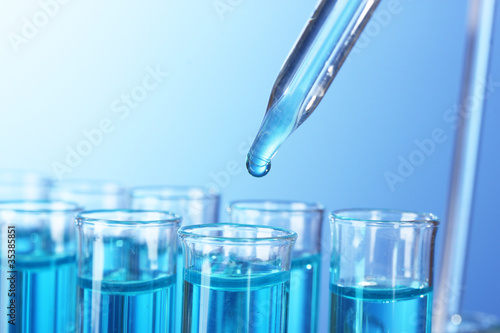 Test-tubes on blue background