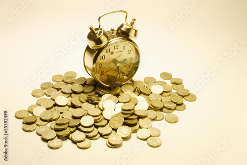 Alarm Clock and Coins photo