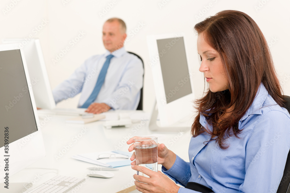 Businesswoman sit in office hold water glass Businesswoman sit in office hold water glass