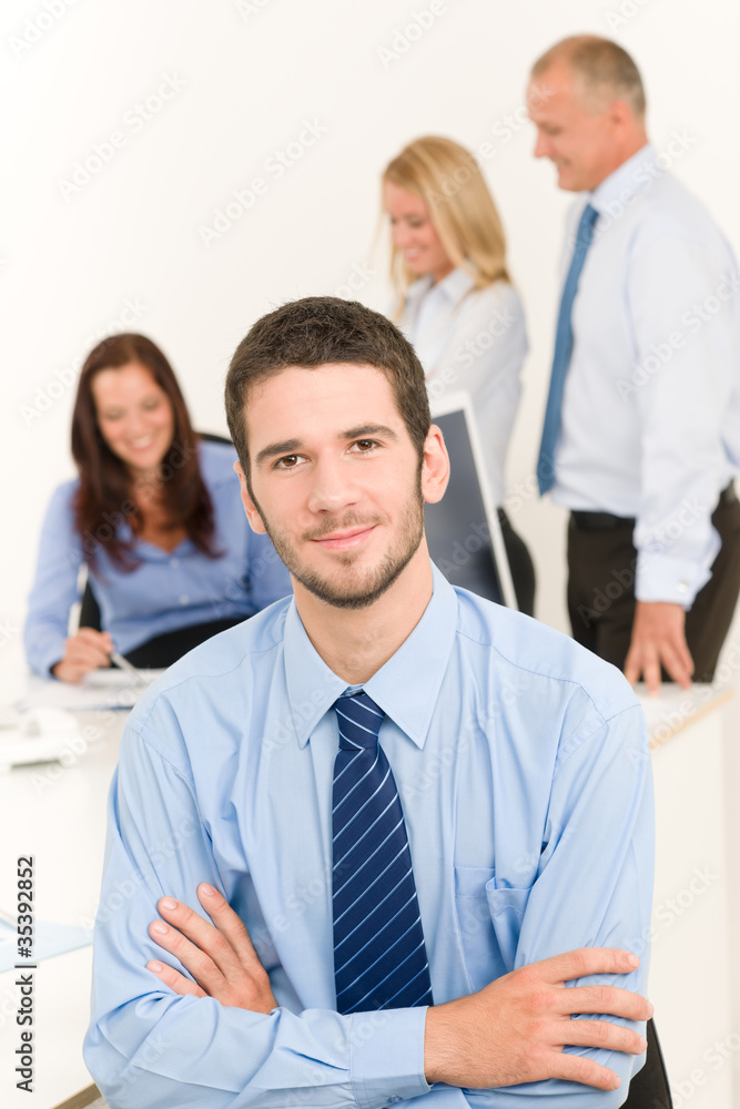 Business team handsome businessman with colleagues Business team handsome businessman with colleagues