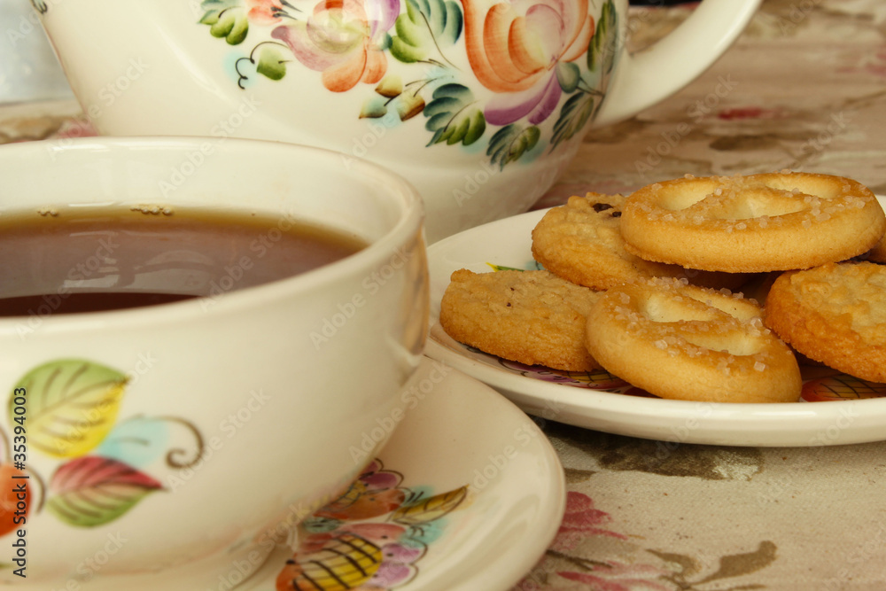 A cup of tea served with biscuits A cup of tea served with biscuits
