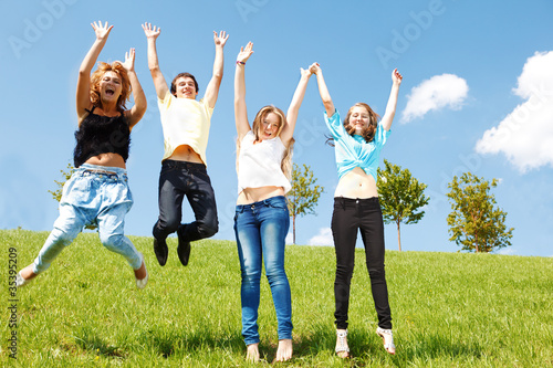 Teenage friends jumping