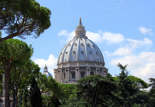 Beautiful basilica surrounded by trees and the blue sky.