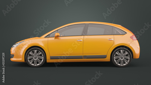 Yellow compact hatchback car on dark background