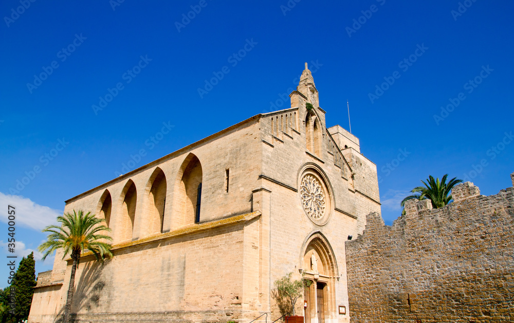 Alcudia Sant Jaume church near roman castle wall Mallorca