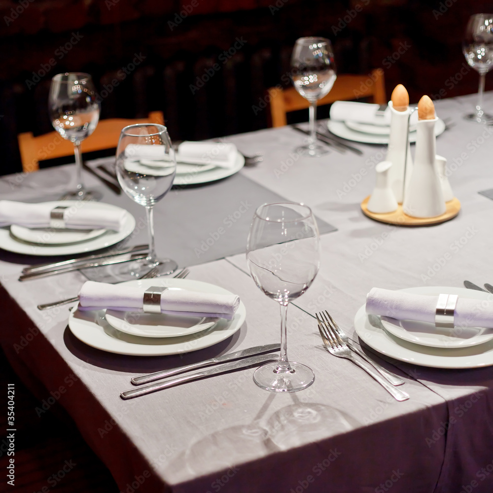 Tables set for meal Tables set for meal