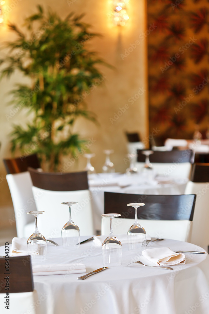 Tables set for meal Tables set for meal