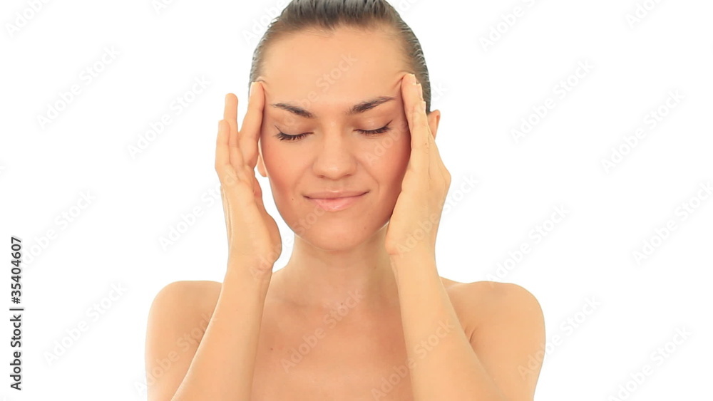 Beautiful woman massaging her head, isolated on white Beautiful woman massaging her head, isolated on white