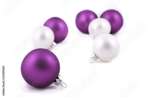 Purple and white christmas decorations on white background