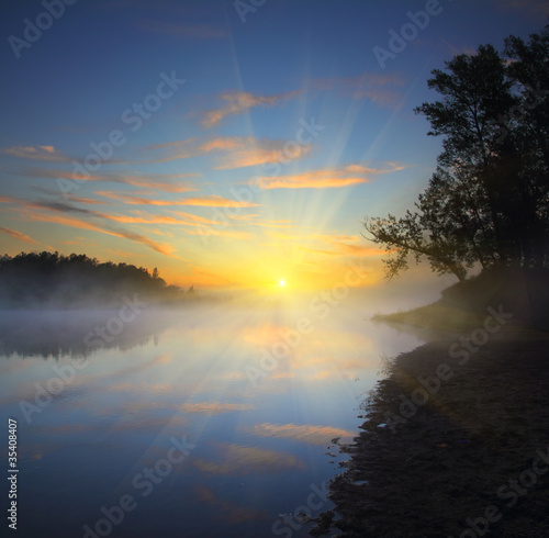 beautiful fog sunrise on river © Kokhanchikov